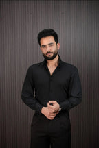 Men styling black slim fit pinstripe shirt with dress pants